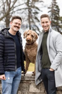 A couple with their doodle dog at Paletta Mansion