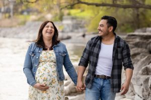 a candid moment of a couple laughing during a photoshoot