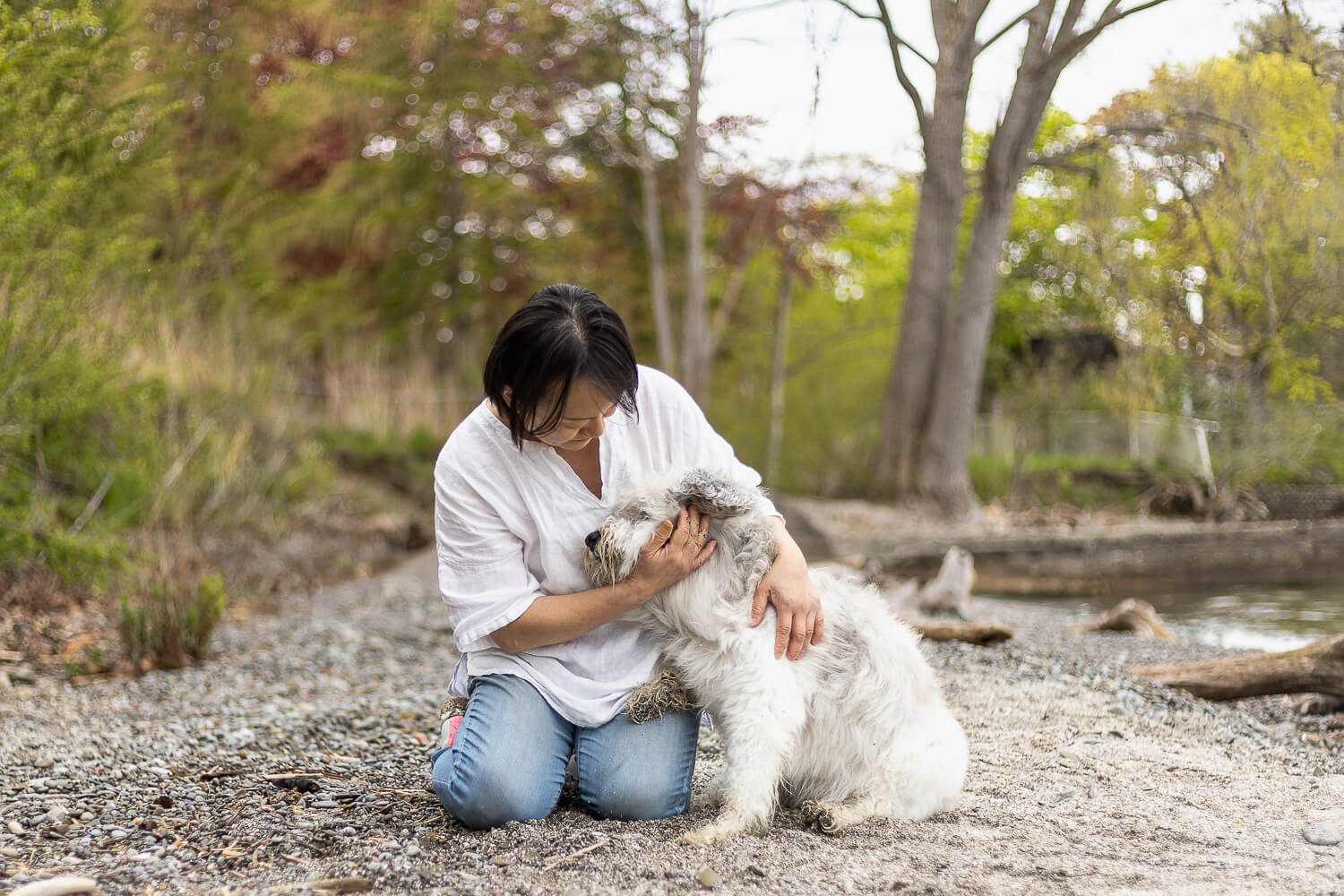 dog and owner photoshoot a dog mom hugging her dog at an end of life dog photo shoot session.