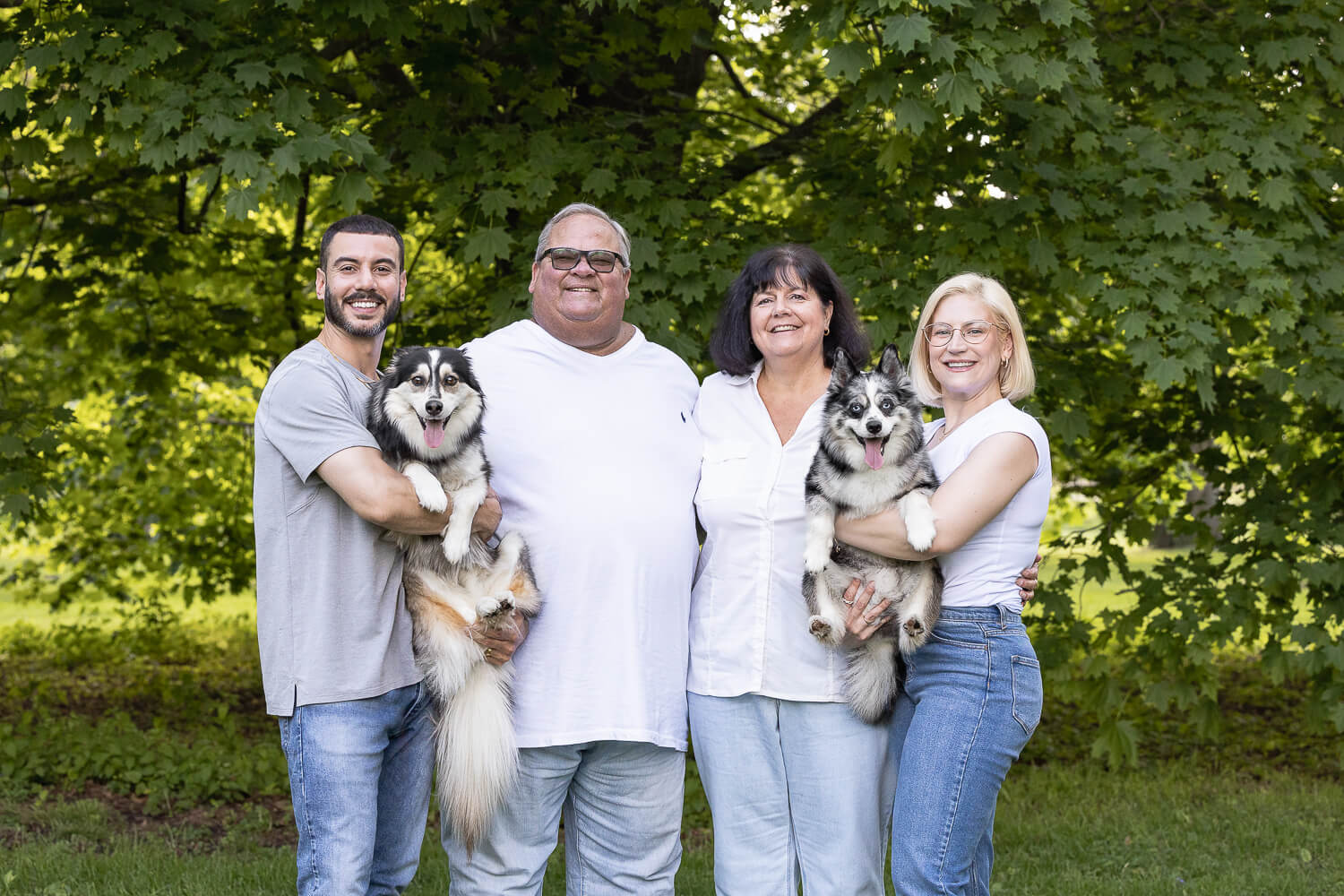a family portrait with two dogs at Springbank Park.