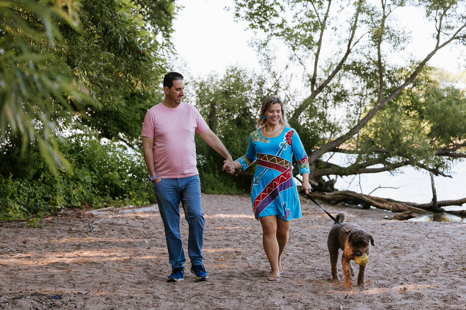 Grimsby pet family photoshoot dog parents walking with his dog at a dog photo shoot session in Grimsby.