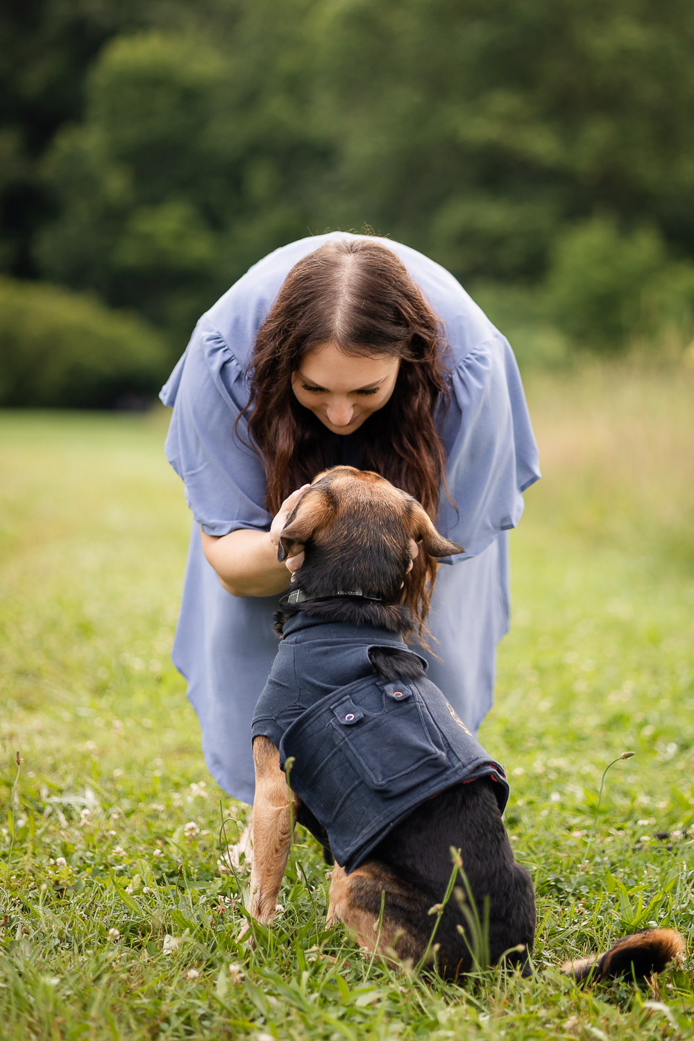 dog mom looking at her dog at a end of life dog photoshoot in Burlington.