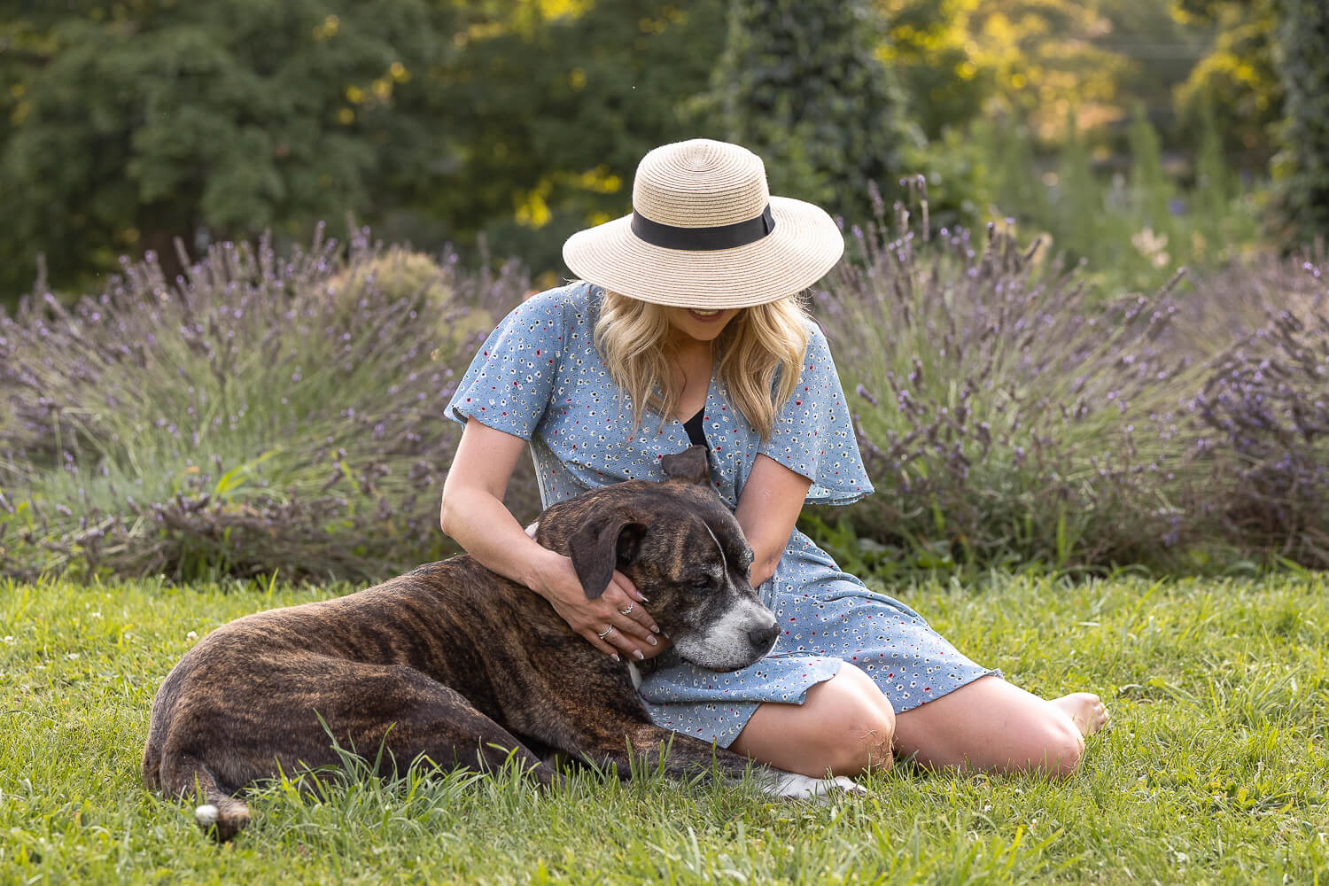 family photo with dog a dog laying on a human lap at a All Who Wander Flower Farm