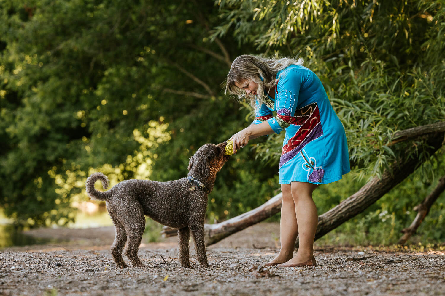 pet family photography dog mom playing with the dog in Grimsby.